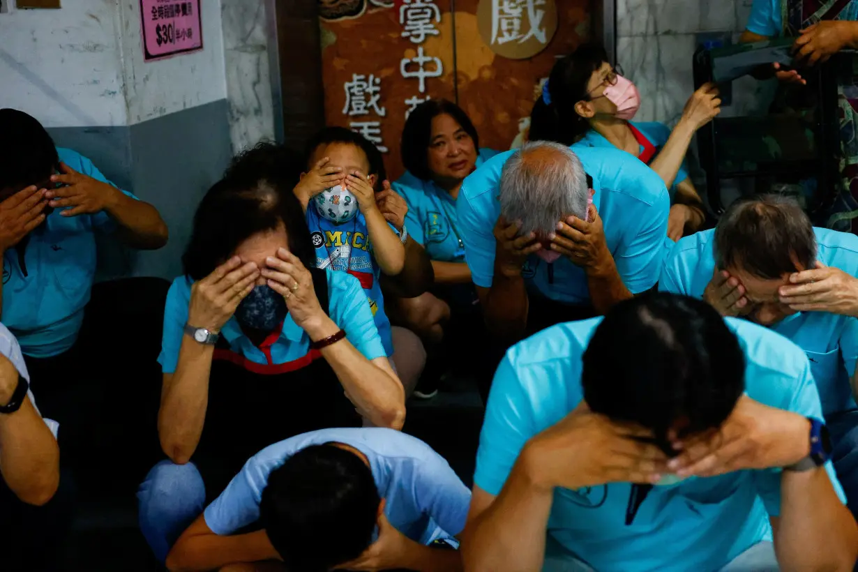 People participate in the annual air-raid exercise in Taipei