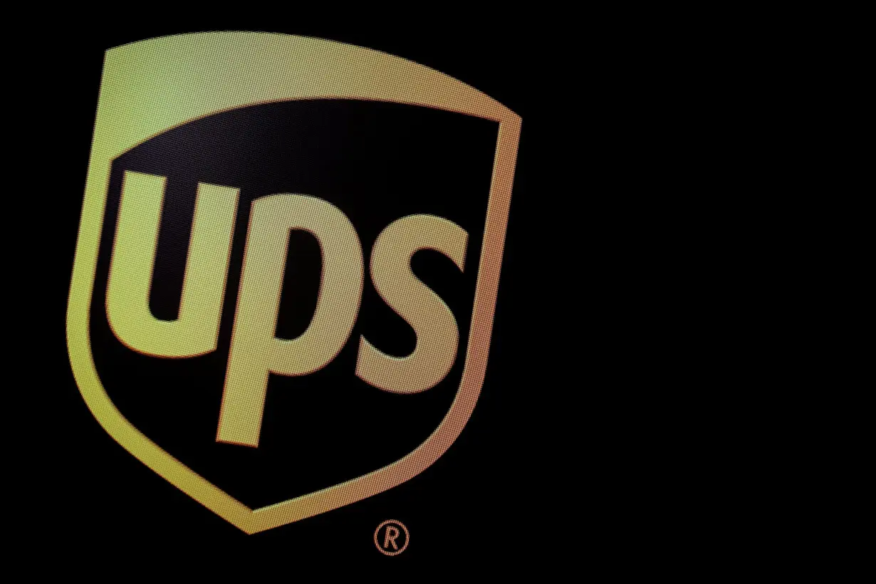 The company logo for United Parcel Service (UPS), is displayed on a screen at the NYSE in New York