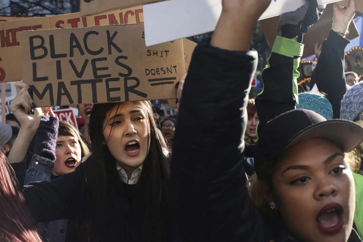 FILE PHOTO: Black Lives Matter protesters shout during Black Friday in Seattle