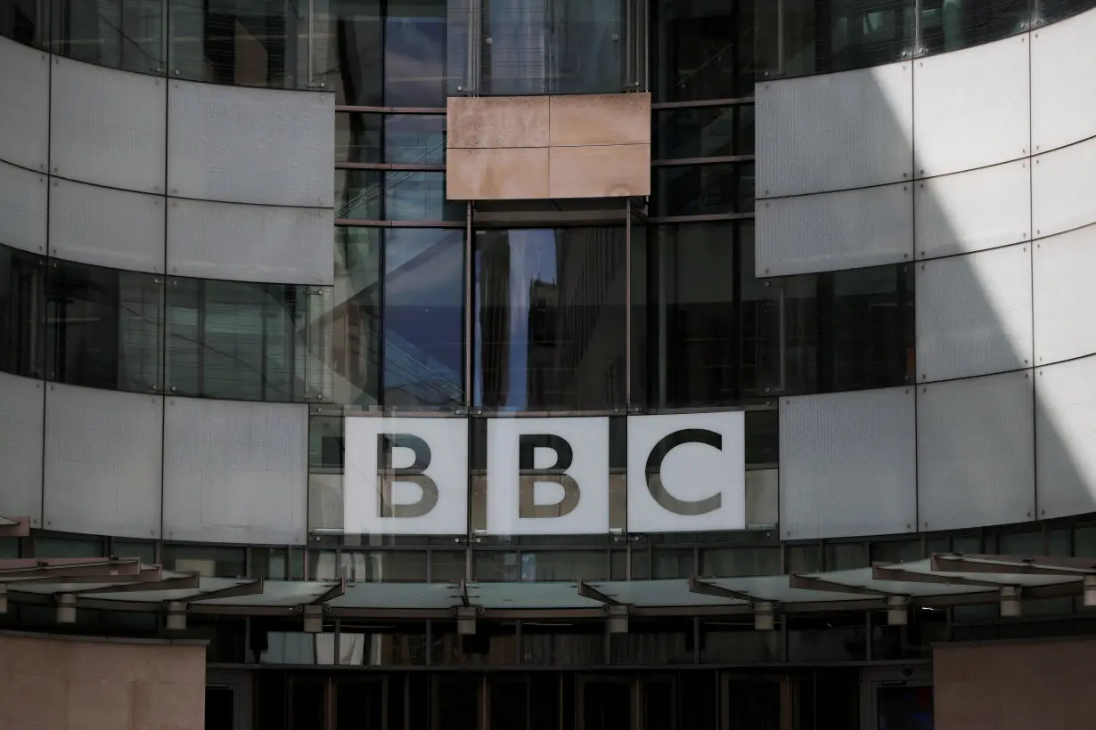 FILE PHOTO: The BBC logo is displayed above the entrance to the BBC headquarters in London