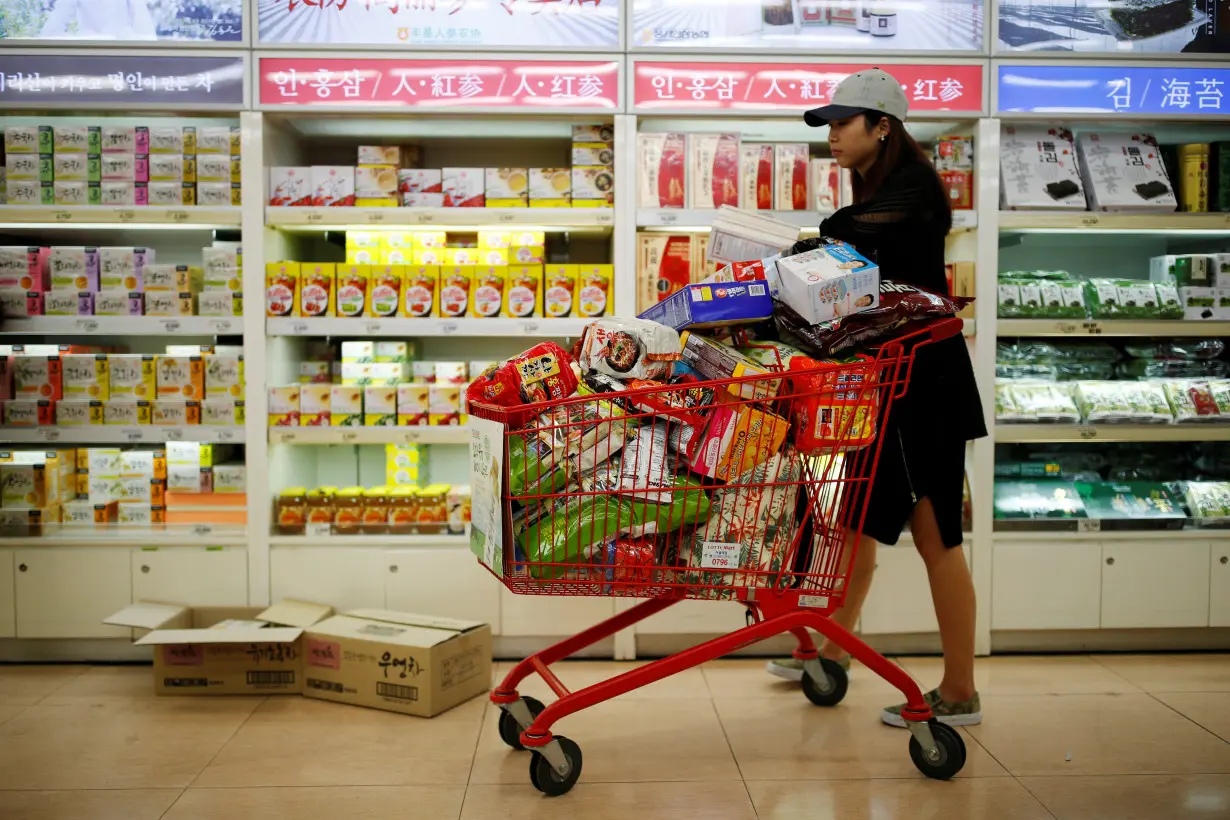 A woman shops at a market in Seoul