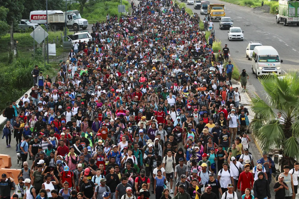 Migrants walk in a caravan toward U.S., in Tapachula