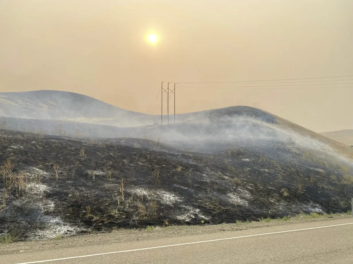 Wildfires threaten communities in the West as Oregon fire closes interstate, creates its own weather