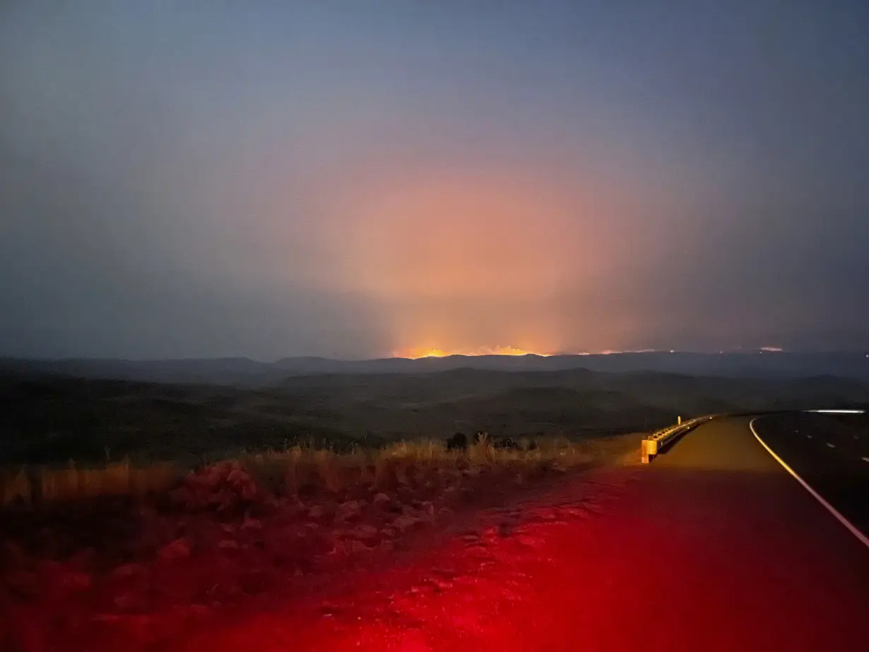 Wildfires threaten communities in the West as Oregon fire closes interstate, creates its own weather