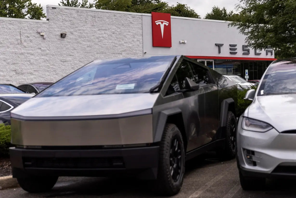 Tesla electric vehicles use a Tesla supercharging station in Union City, New Jersey