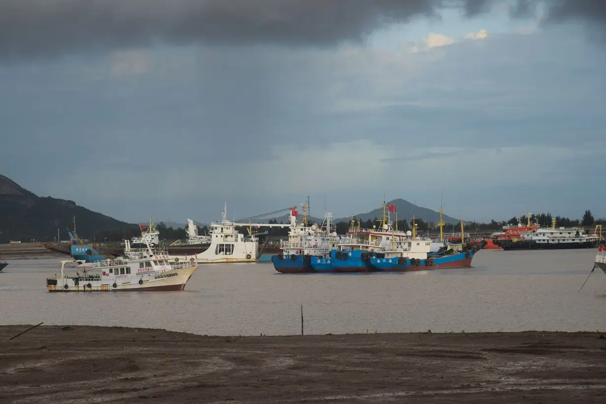 Boats return to port to shelter from Typhoon Gaemi on July 23, in Taizhou, China.