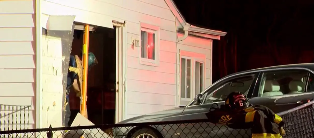 Car crashes into northeast Baltimore home, trapping family inside