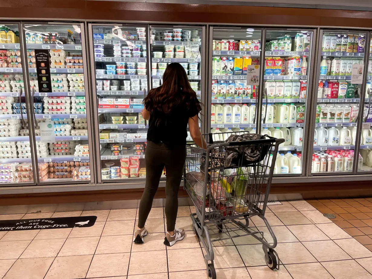 FILE PHOTO: A woman shops in a supermarket as rising inflation affects consumer prices in Los Angeles