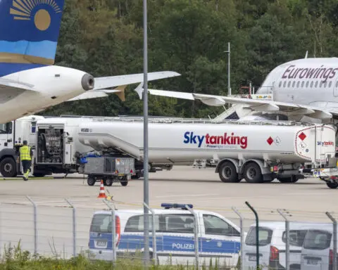 Climate activists glue themselves to a taxiway at Cologne-Bonn Airport, flights suspended