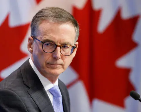 Bank of Canada cuts rates, sees weaker economy in 2024