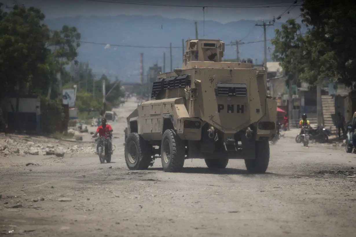 FILE PHOTO: Haitian National Police patrols in an armoured vehicle in the Cite Soleill