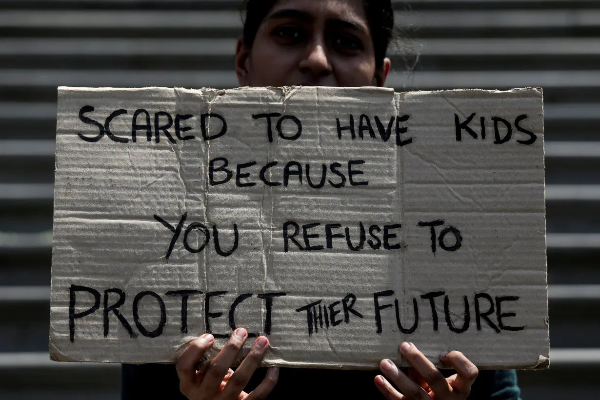 FILE PHOTO: FILE PHOTO: A student takes part in a global protest against climate change in Mumbai