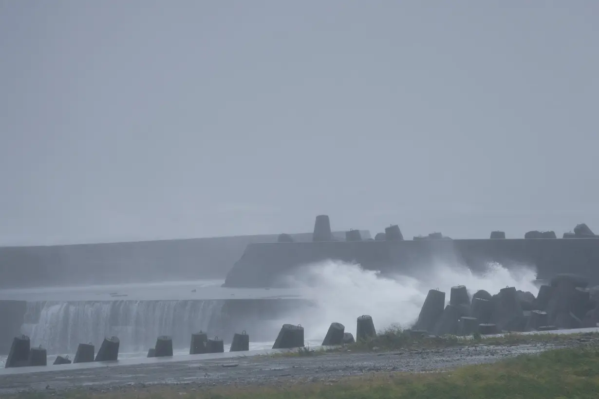 Waves break on the shore protections after Typhoon Gaemi passed northern Taiwan in Yilan