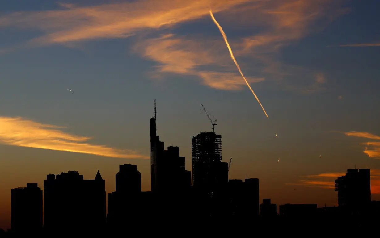 The sun sets behind the skyline during a warm autumn evening in Frankfurt