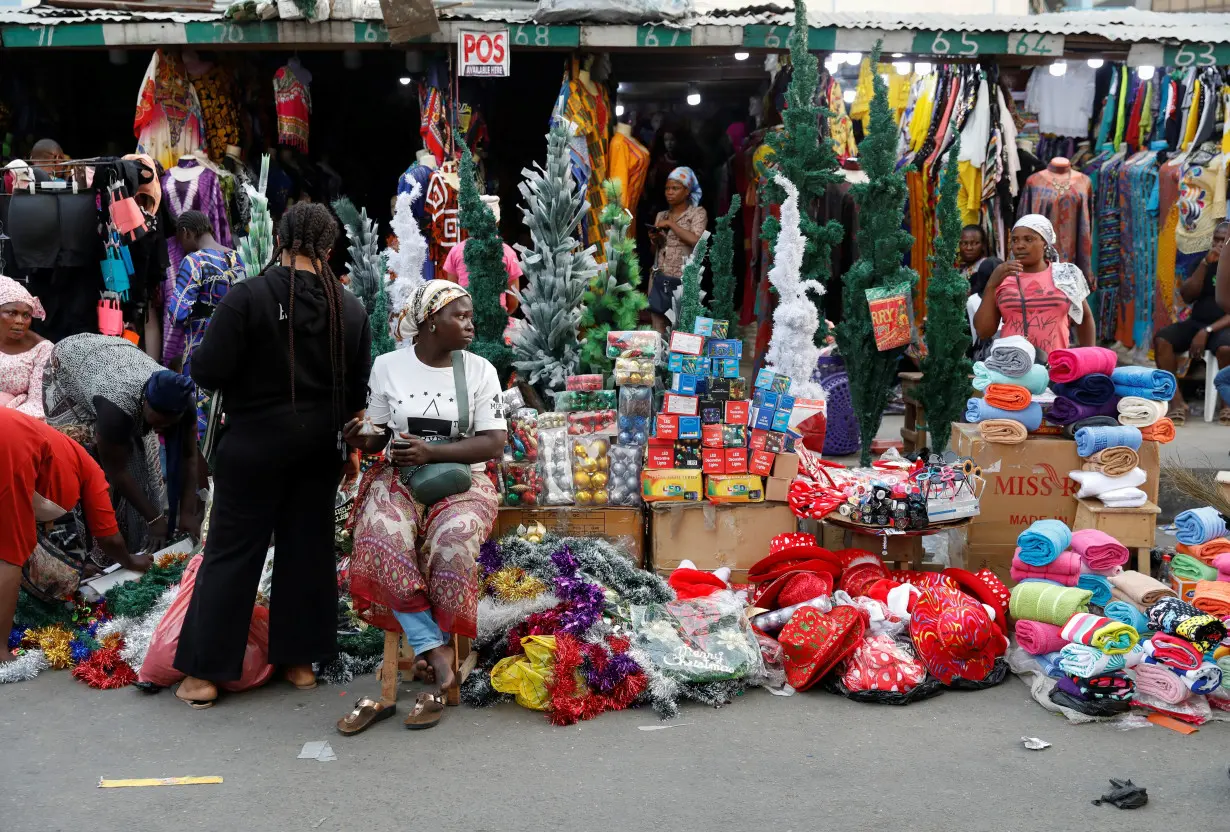 People shop for Christmas decorations in a market in Lagos