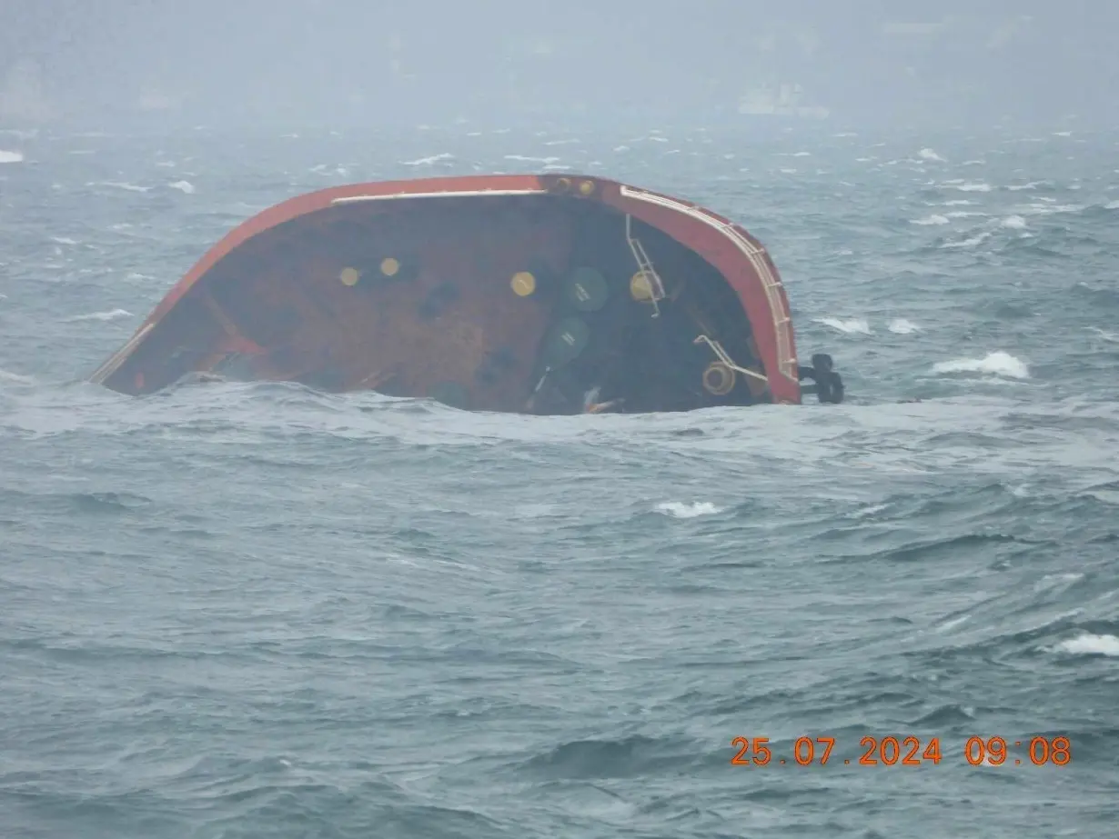 A handout photo released by the Philippine Coast Guard shows the tip of MT Terra Nova protruding in Manila Bay, Philippines, July 25.