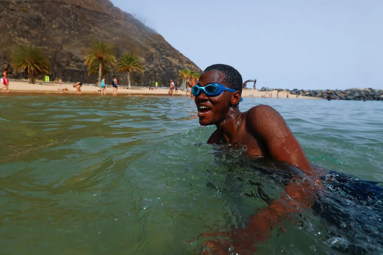 Volunteers help migrants reverse water trauma in Spain's Canaries