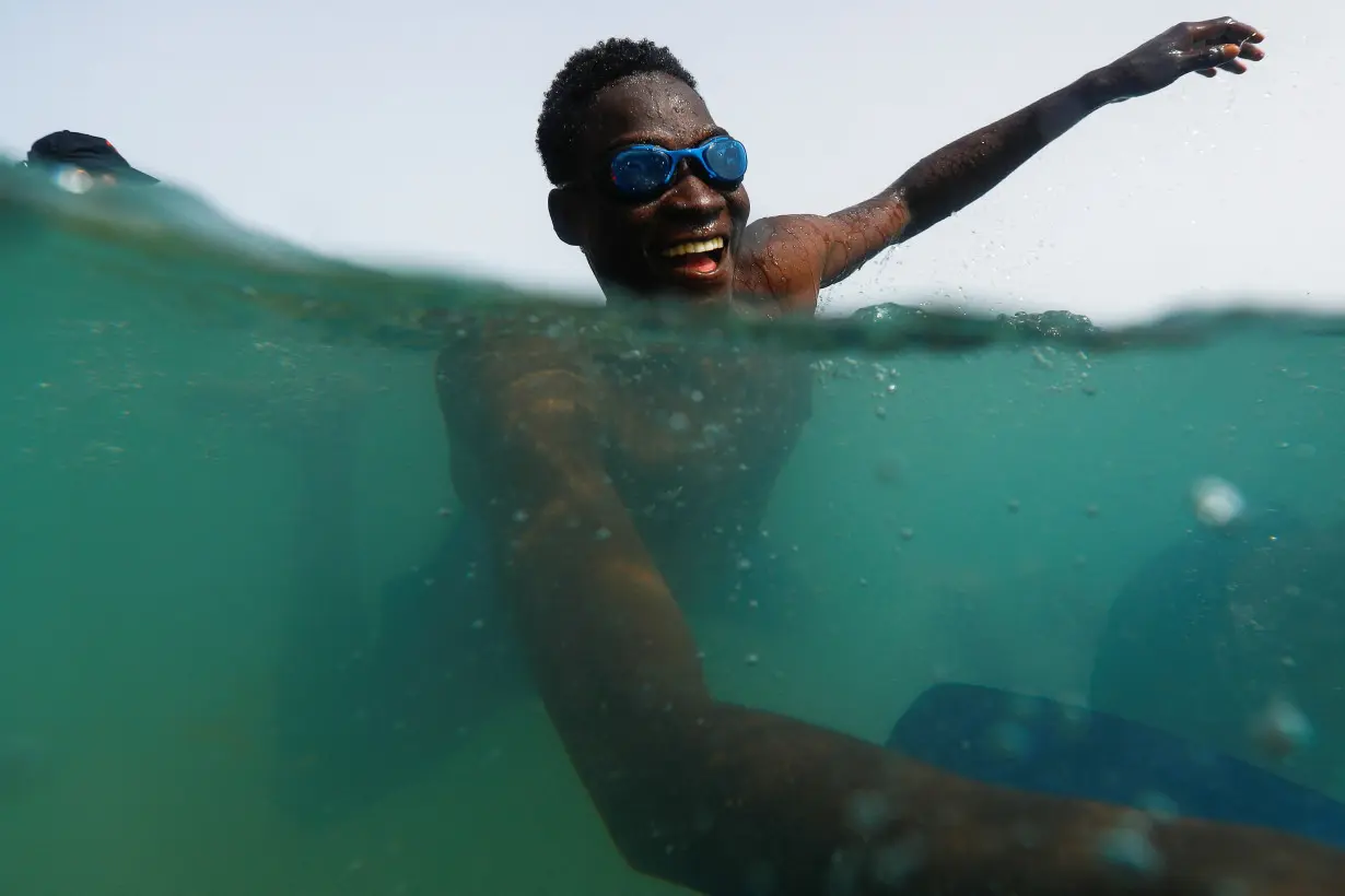 Volunteers help migrants reverse water trauma in Spain's Canaries