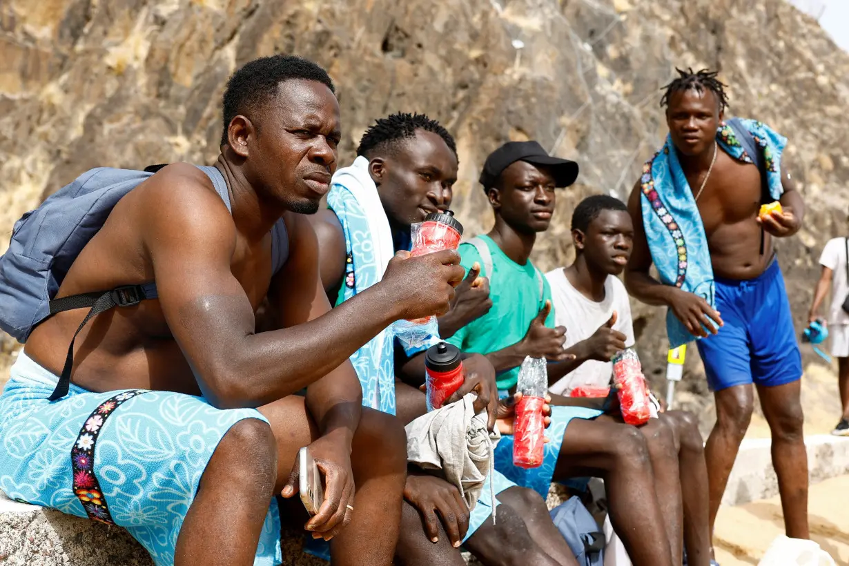 Volunteers help migrants reverse water trauma in Spain's Canaries