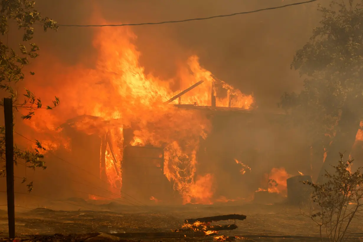 Man started California wildfire by pushing burning car into gully, prosecutor says