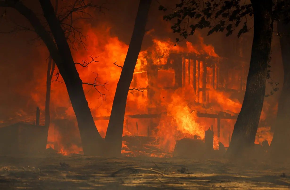 Man started California wildfire by pushing burning car into gully, prosecutor says