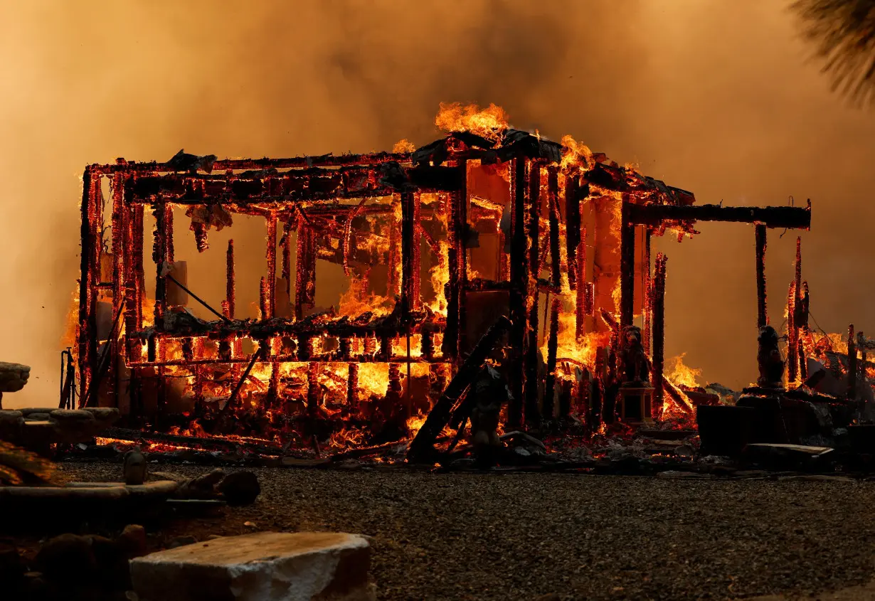 Man started California wildfire by pushing burning car into gully, prosecutor says