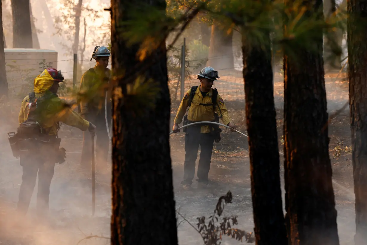 Man started California wildfire by pushing burning car into gully, prosecutor says