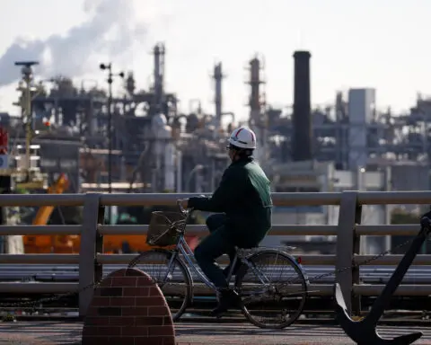 Japan June industrial output seen down on auto production suspention: Reuters poll