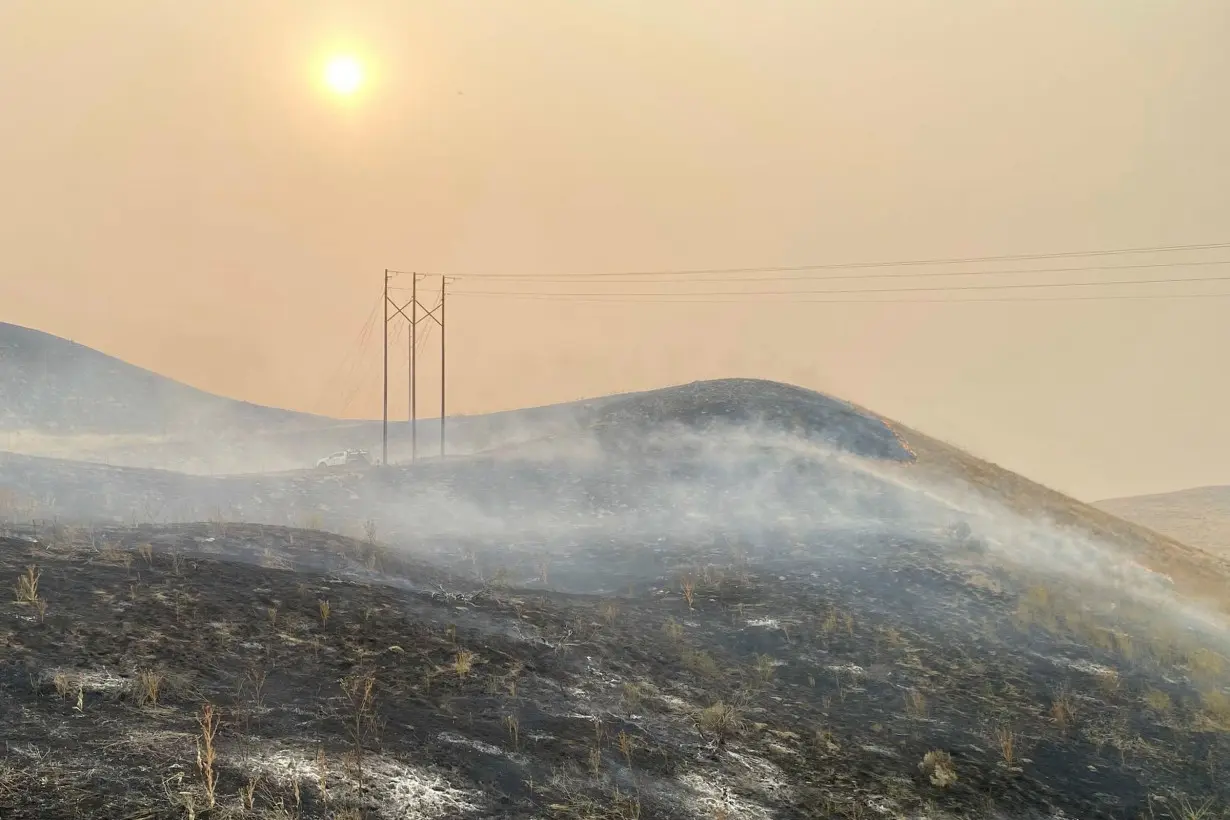 In this image provided by the Oregon Department of Transportation, shows an area burned by the Durkee fire near Interstate 84 close to Huntington, Oregon, on July 23.