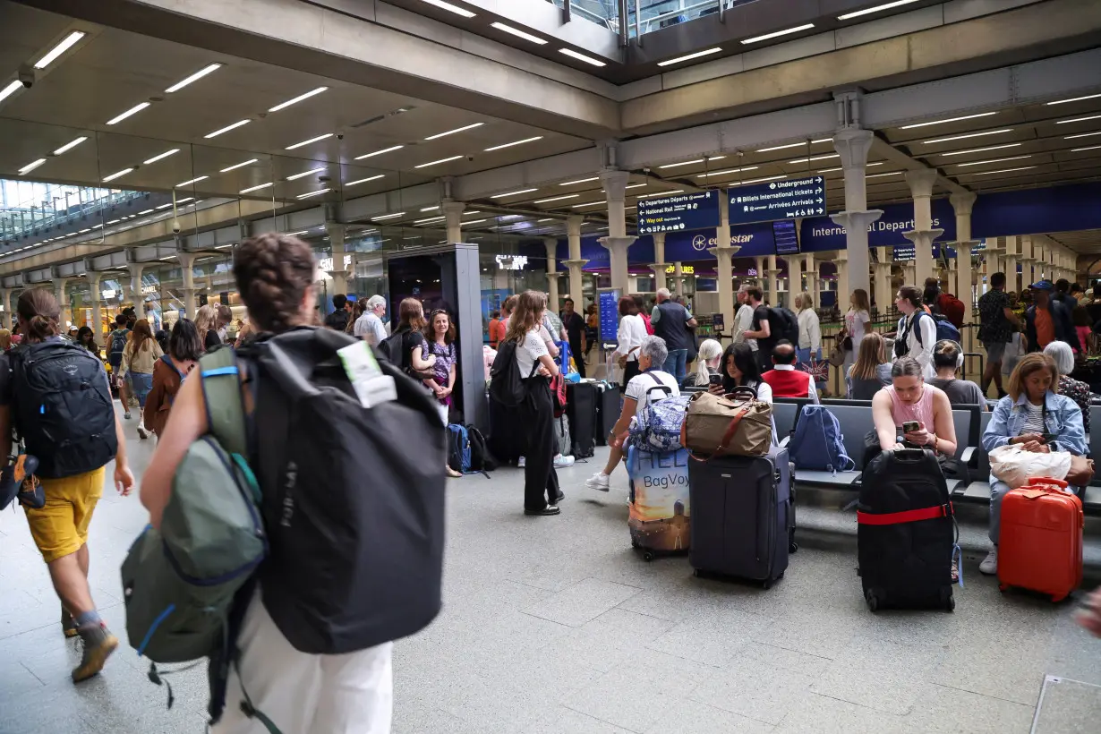 Passengers wait at the Eurostar terminal in St. Pancras International Station, in London