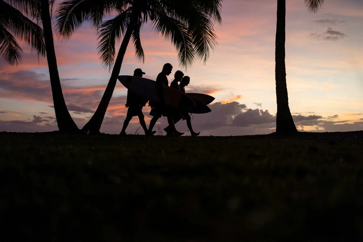 Brazil's surfing team members in Teahupo'o, Tahiti, French Polynesia