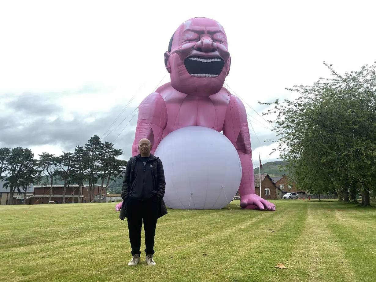 Giant pink man causes stir in small Welsh town