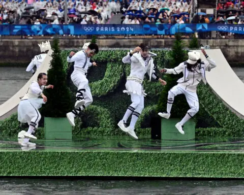 Olympics-Flotilla on Seine, rain and Celine Dion mark start of Paris Olympics