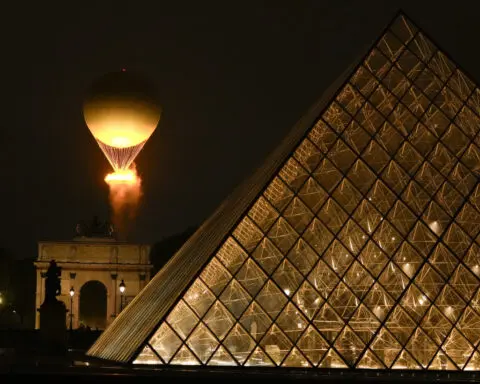 Paris dazzles with a rainy Olympics opening ceremony on the Seine River