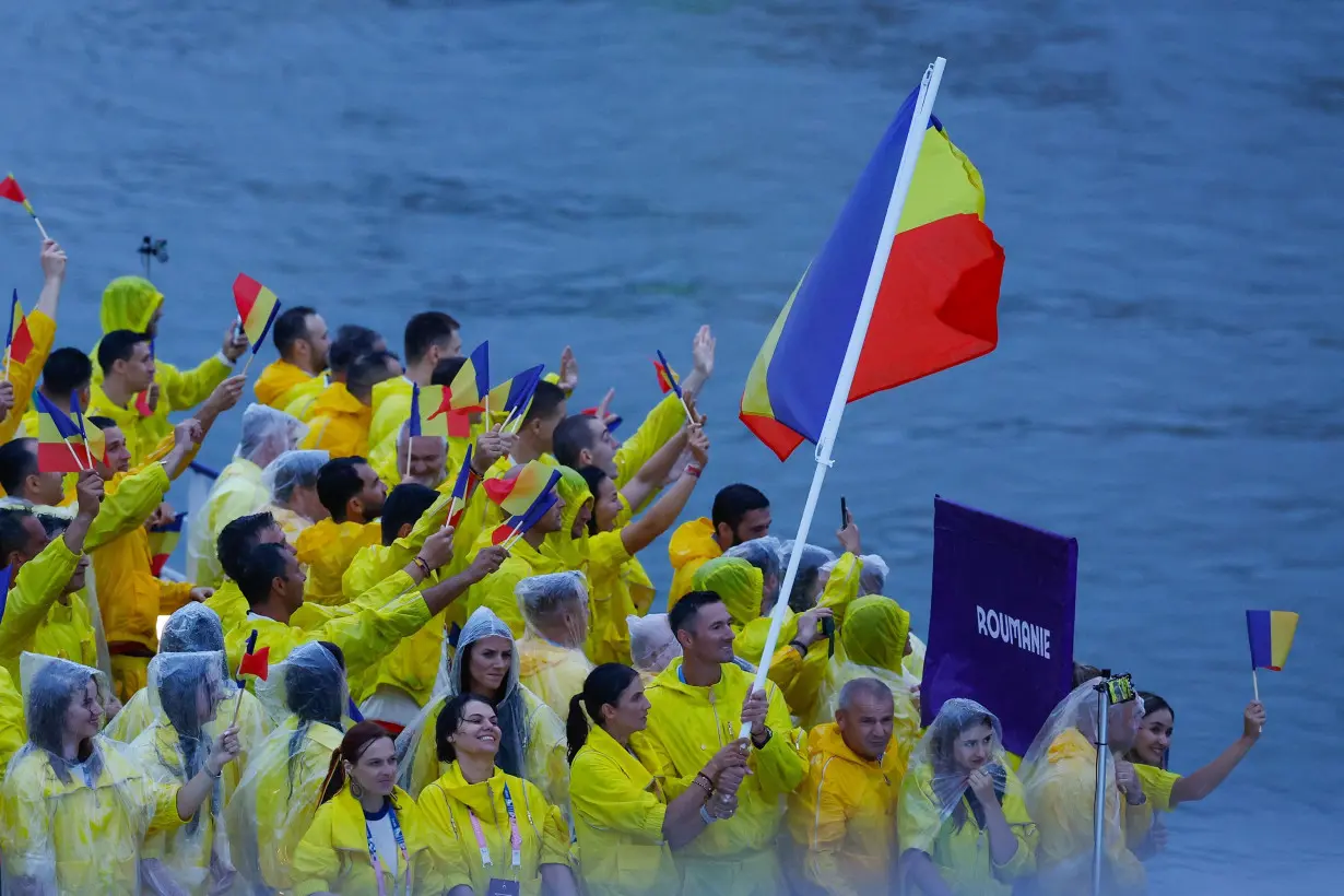 Olympic moment of the day: Married couple makes history as Romania's flag bearers