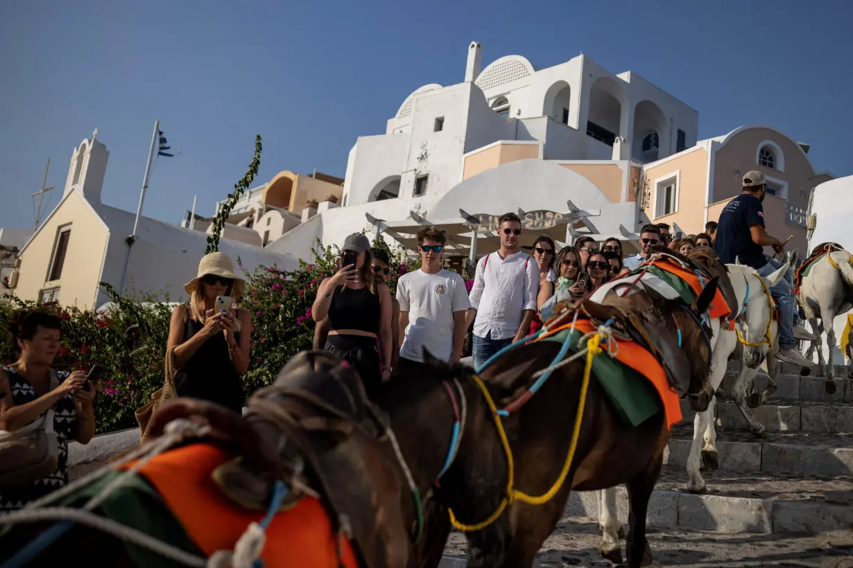 Greece's Santorini bursts with tourists as locals call for a cap