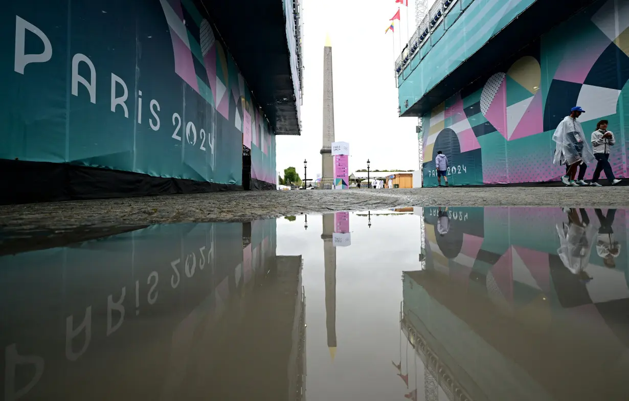 Pouring rain disrupts Games after drenched opening ceremony