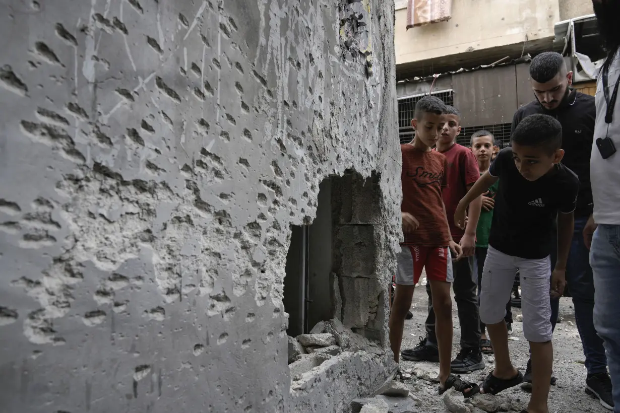 An Israeli airstrike hits a school sheltering people in Gaza, killing at least 30 including children