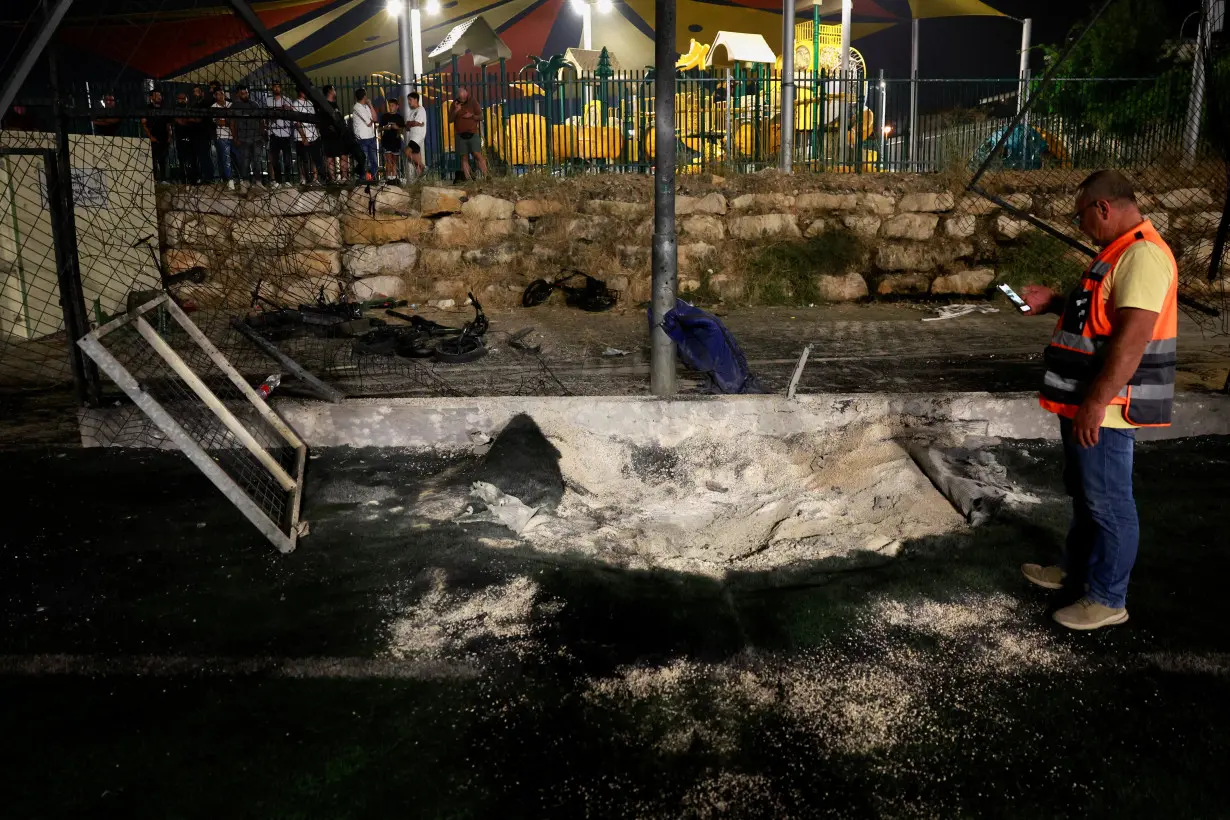 Israel says Hezbollah rocket kills 12 at football ground, vows response