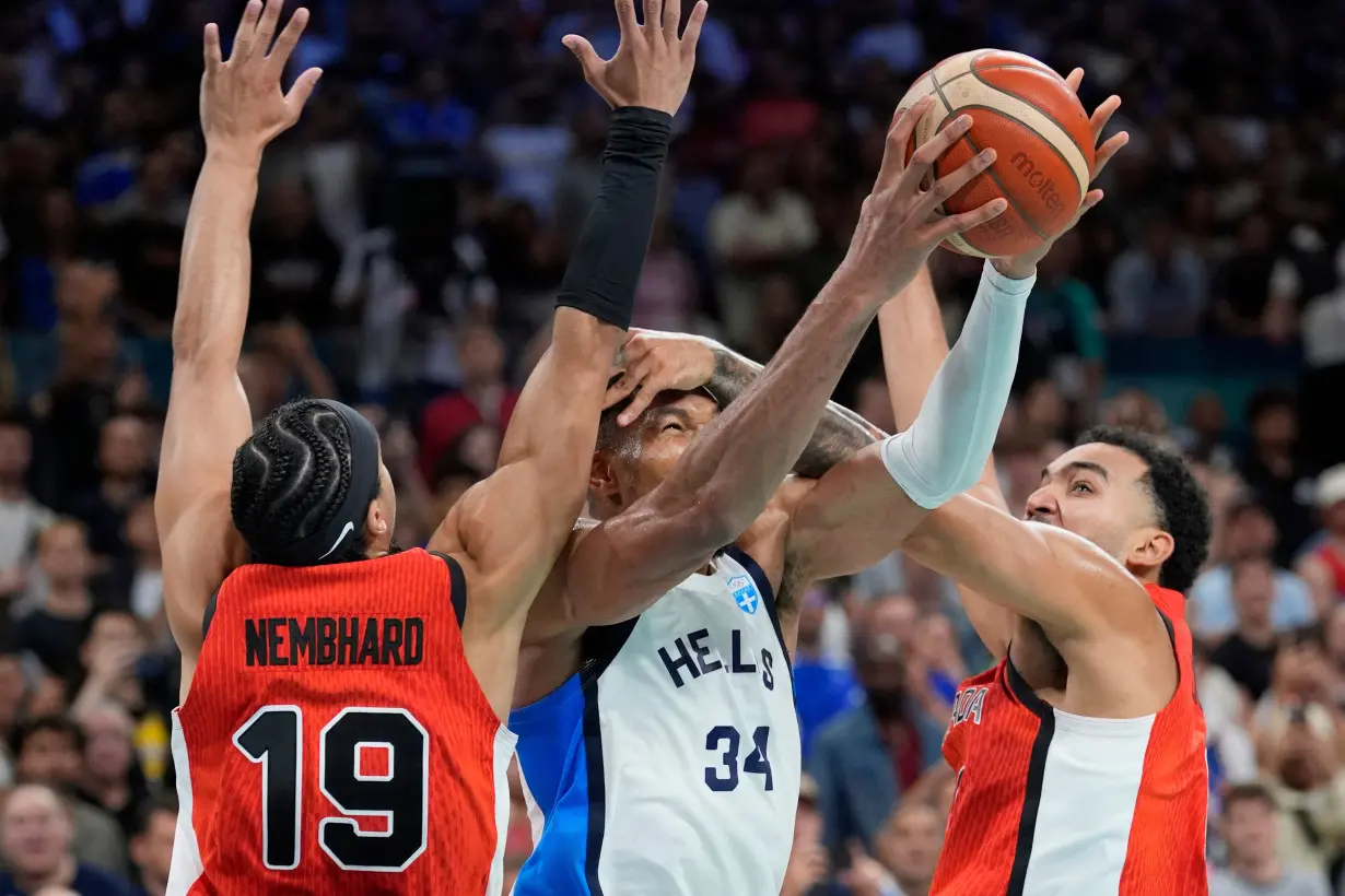 Olympics-Basketball-Wembanyama helps France win, Antetokounmpo's Greece lose to Canada