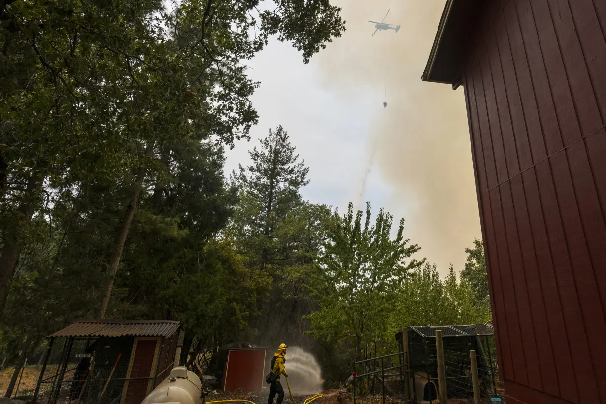 Firefighters helped by cooler weather battle blaze that has scorched area size of Los Angeles