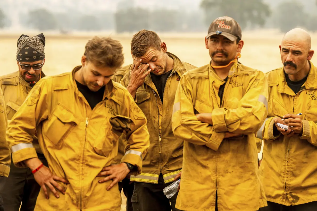 Firefighters helped by cooler weather battle blaze that has scorched area size of Los Angeles