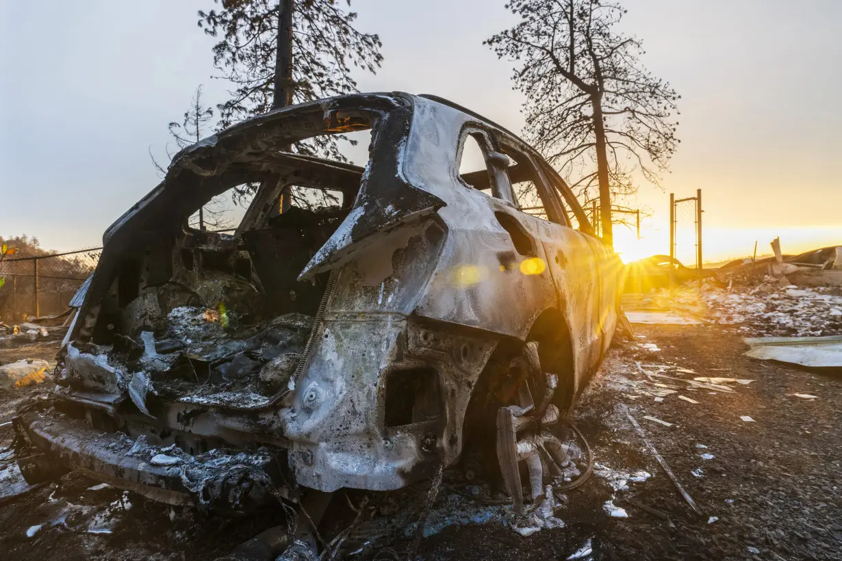 Firefighters helped by cooler weather battle blaze that has scorched area larger than Los Angeles