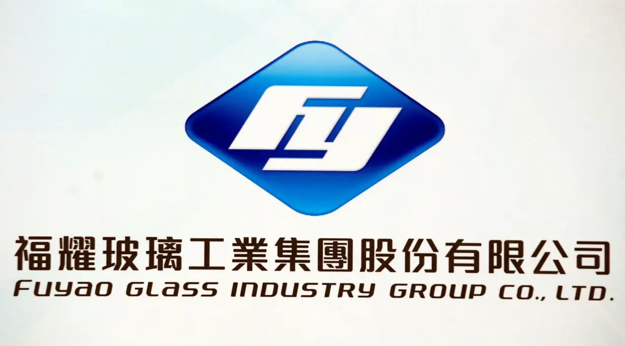 The company logo of Fuyao Glass Industry Group is displayed during a news conference in Hong Kong