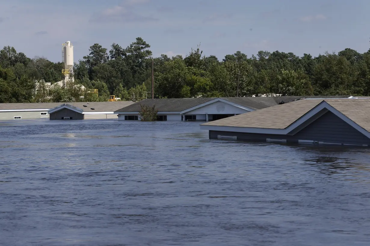 Submerged houses are seen by flood waters from Tropical Storm Harvey in Rose City