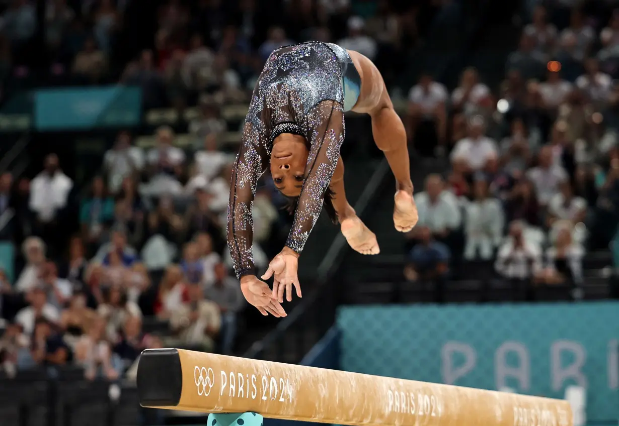 Simone Biles fights through calf injury to produce impressive performance on Olympic return