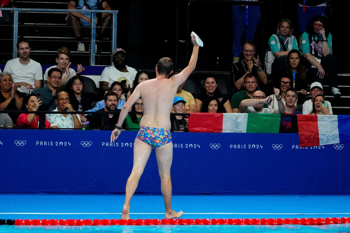 Olympic moment of the day: Cap-catching lifeguard steals the swimming show