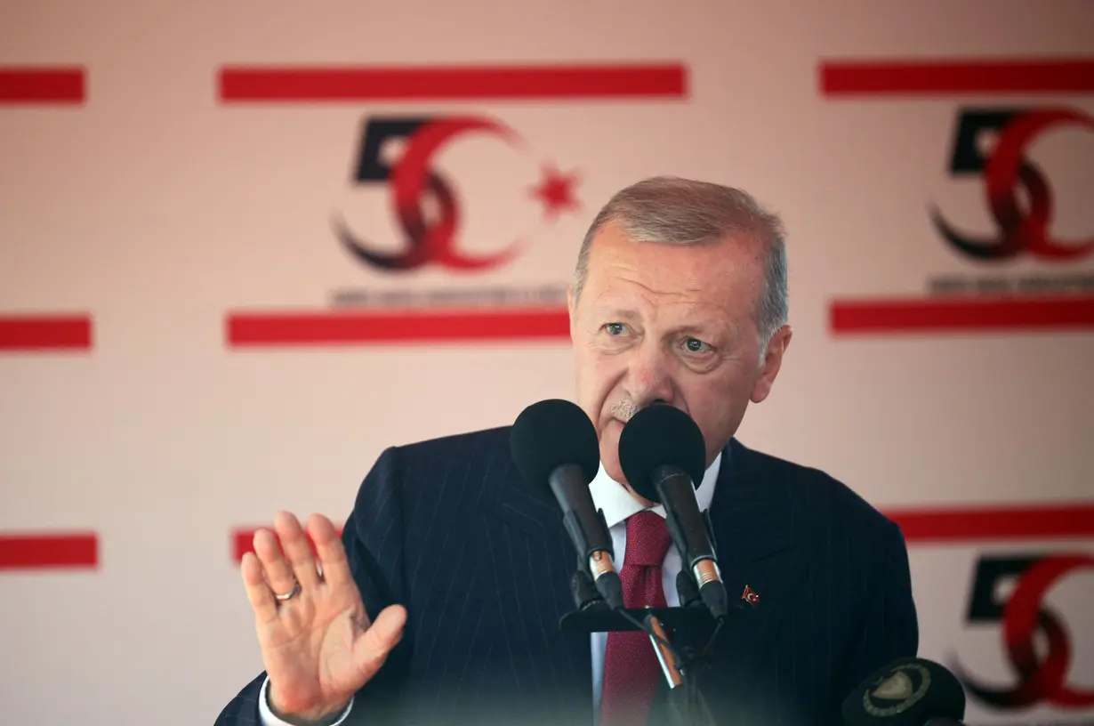 Turkish President Tayyip Erdogan attends a military parade to mark the 1974 Turkish invasion of Cyprus in response to a short-lived Greek-inspired coup, in the Turkish-controlled northern Cyprus, in the divided city of Nicosia