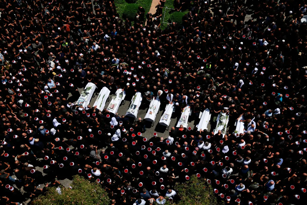 Funeral of children who were killed at a soccer pitch by a rocket fired from Lebanon, in Majdal Shams