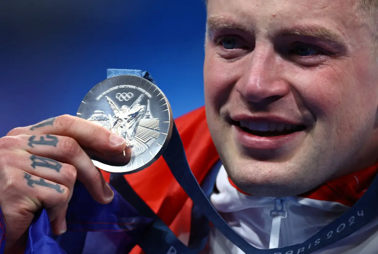 Swimming - Men's 100m Breaststroke Victory Ceremony